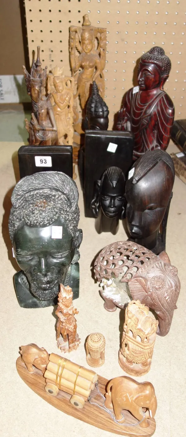 A quantity of mainly 20th century African and eastern carved wooden and stone figures and heads. S1B