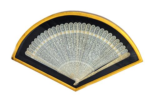 A Canton ivory brisé fan, 19th century, with three oval cartouches detailed with a pagoda against a landscape, the sticks finely carved with flora, fa