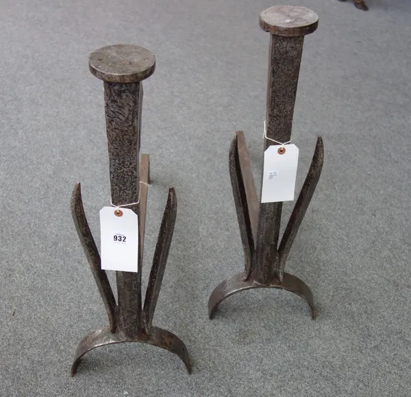 A pair of steel andirons of chamfered form, with disc finials, 65.5cm high (2).