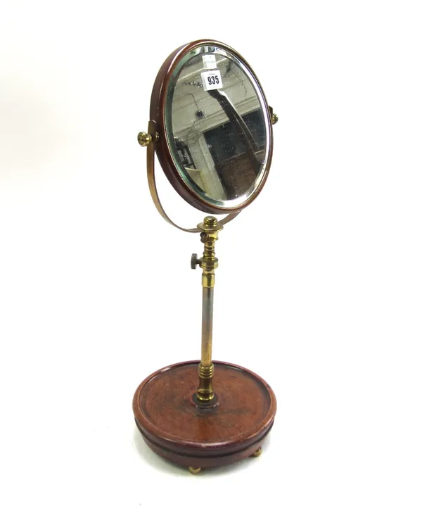 A mahogany and brass adjustable shaving mirror, 57cm high.  58