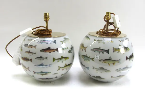 A pair of modern decalcomania glass table lamps, each of spherical form decorated with fish, 25cm high excluding fitments (2).
