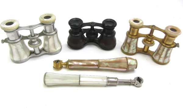 A pair of Negretti and Zambra mother-of-pearl opera glasses, and two further pairs of opera glasses (3).  82