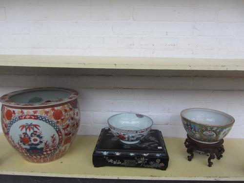A Cantonese famille verte bowl, late 19th century (lacking cover), raised on a hardwood stand, 25cm diameter, an early 20th century Japanese lacquer a