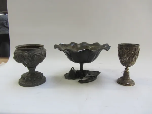 A bronze bowl of foliate shaped form, 20th century, 30cm diameter, together with a silvered brass goblet relief cast with classical figures, 20cm high