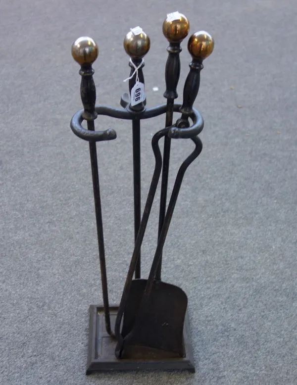 A set of ebonised steel fire tools and stand with spherical brass finials (shovel 70cm), a pair of patinated metal 'Owl' andirons and an Art Nouveau s