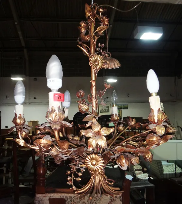 A gilt metal six branch chandelier of naturalistic form.