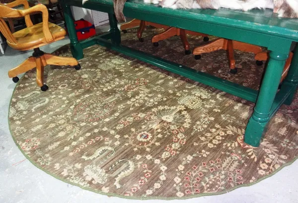 A machine made green circular carpet.