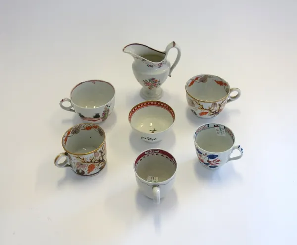 A group of English porcelains, late 18th century, comprising; a New Hall `446' pattern coffee can and teacup; a New Hall pattern `421, teacup; a New H