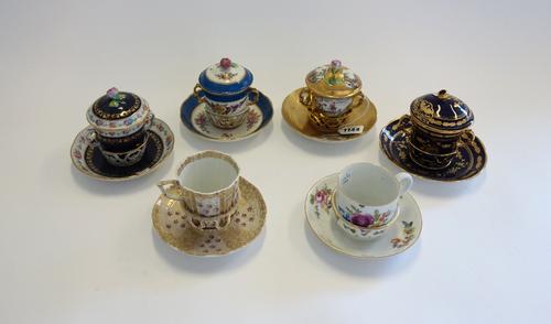 Six European porcelain cups and trembleuse saucers, late 18th century to late 19th century. (6)