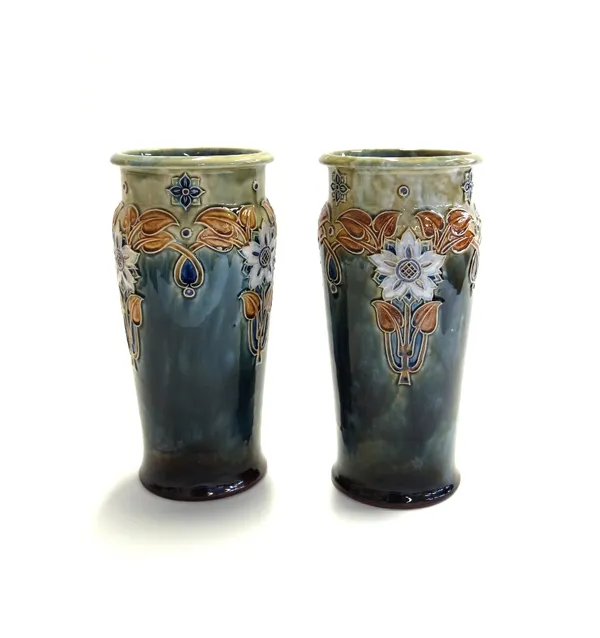A pair of Royal Doulton stoneware vases, early 20th century, each decorated in the Art Nouveau style with a band of stylised flowers against a mottled