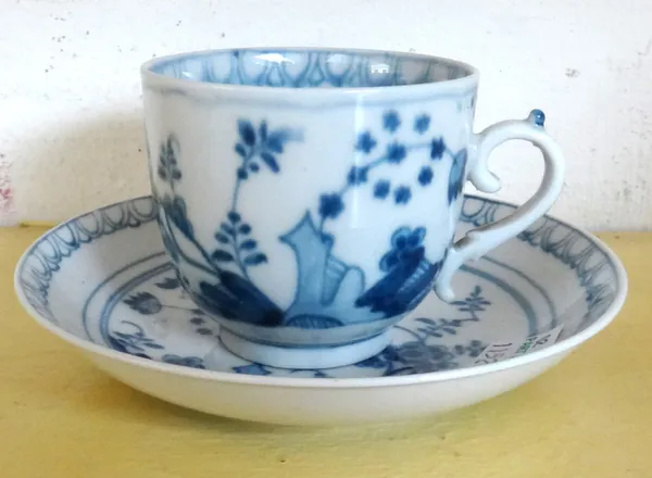 A Meissen blue and white cup and saucer, mid 18th century, painted with the `Bird and Rock' pattern, blue crossed swords mark and number 8.
