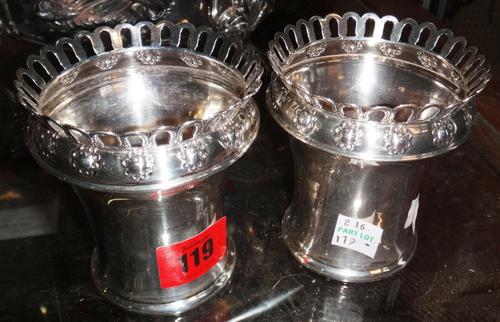 A pair of silver vases of slender waisted form, with pierced gallery rim, London 1905, together with another smaller vase with embossed decoration and
