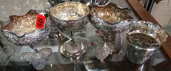 A Chinese silver pedestal bowl, with embossed floral decoration and presentation inscription, together with a pair of Middle Eastern white metal pedes