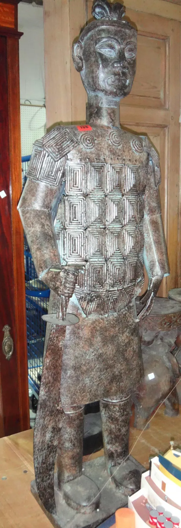 A 20th century patinated tin model of an Oriental soldier.