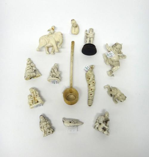 A group of twelve Japanese ivory carvings, Meiji period, mostly netsuke, various subjects including a man on an elephant, Hotei and child, a Daruma do