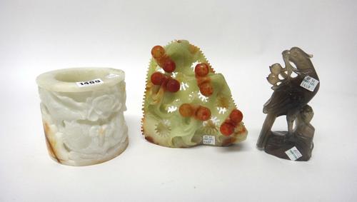 A group of Chinese objects, 20th century, comprising; a jade brushpot decorated in relief with fish amongst lotus, 11cm. high; an agate figure of a bi