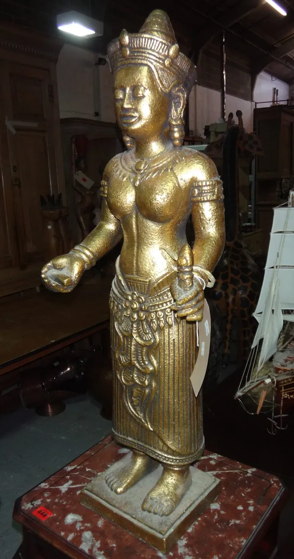 A 20th century hardwood carved figure of an Oriental lady, together with a gilt fibreglass model of Buddha.
