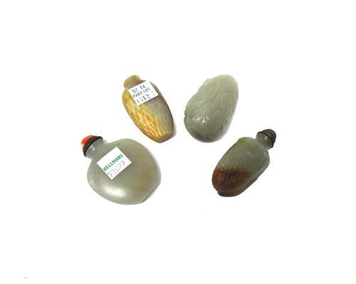 Four Chinese jade snuff bottles, late 19th/20th century, comprising; one of pebble form carved with leafy branches; one of plain shield shape; one wit
