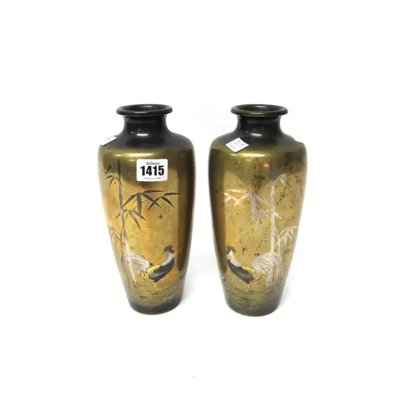 A pair of Japanese bronze vases, Meiji period, of slender tapered form, each inlaid in copper, silver and gilt with a cockerel and hen amongst bamboo,