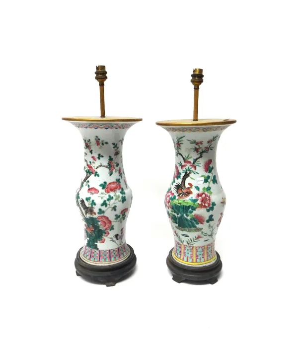 A near pair of Chinese famille-rose porcelain vases, circa 1900, of slender baluster form, painted with cockerels and hens amongst flowering shrubs an