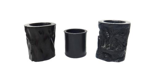 Three Chinese brush pots, 20th century, comprising; a hardwood cylindrical example, 13cm. high; a wood brush pot carved with a seated sage beaneath pi