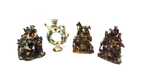 Four Canakkale pottery vessels, Ottoman Turkey, late 19th/early 20th century, comprising; three bowls and covers, supported by horses, cats and branch