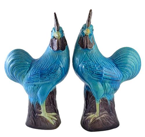 A pair of porcelain figures of cockerels, probably Chinese, 20th century, each standing facing to the left or right, coloured in turquoise and mangane