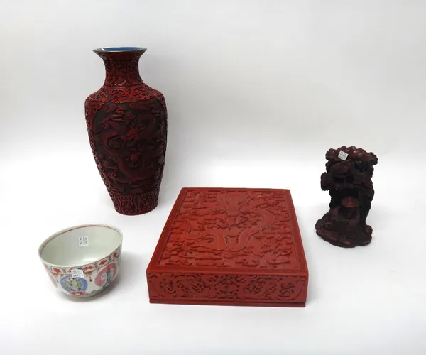 A red lacquer type rectangular box and cover, 20th century, decorated with a dragon and flaming pearl, 32cm. by 25cm; also  a red lacquer vase with dr