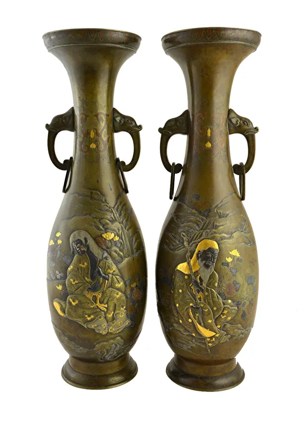 A pair of Japanese bronze two-handled vases, Meiji period, of slender baluster form, each inlaid in gold, silver and copper with a figure seated in a