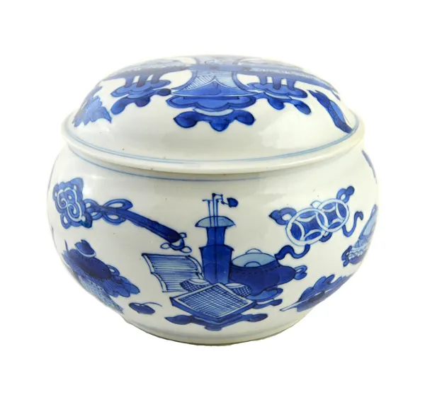 A Chinese blue and white circular box and cover, Kangxi, each painted with vases and buddhist emblems, 12cm.diameter. Provenance: Guest & Gray, London
