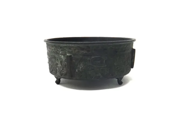 A Chinese archaistic bronze censer, of drum form, raised on three supports, the sides decorated in relief with taotie masks against a leiwen ground, s