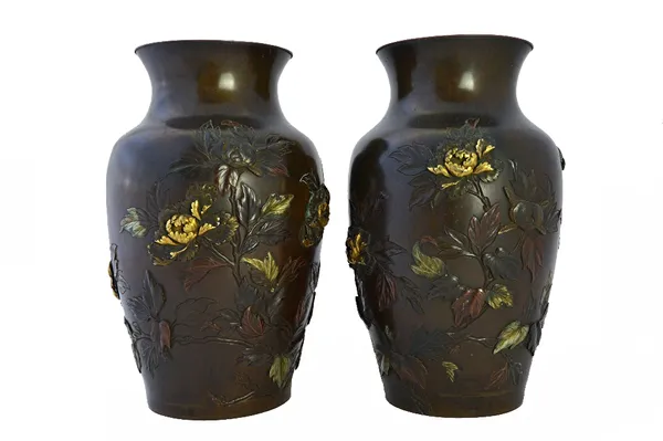A good pair of Japanese bronze vases, Meiji period, of ovoid form, carved in low relief and inlaid in high relief with birds amongst chrysanthemum in
