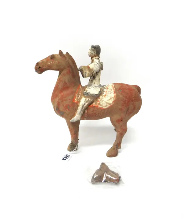 A Han style grey pottery equestrian figure, picked out in white, red and black pigments, (a.f), 29cm.high.