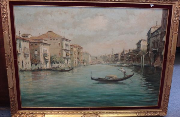 Manner of Rodolfo Paoletti (20th century), The Grand Canal, looking towards the Rialto Bridge, Venice, oil on board, bears a signature, 68cm x 98cm.