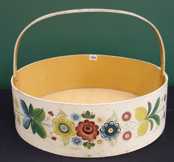 A large floral painted circular trug with loop handle, 54cm wide.