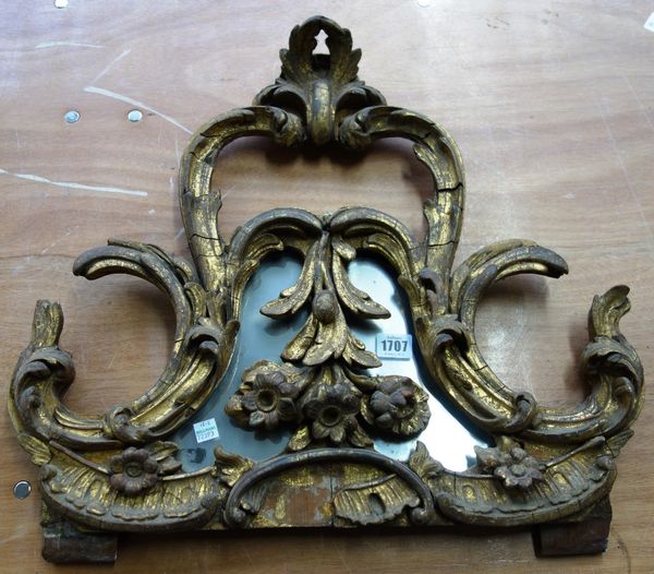 A 19th century gilt framed acanthus scroll and flower carved mirror pediment, 55cm wide x 47cm high.