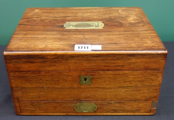 An early 19th century rosewood toilet box with fitted interior and lower drawer, 31cm wide.