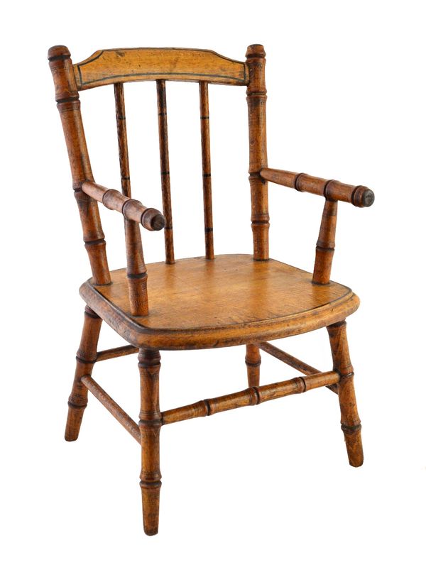 A 19th century beech framed miniature open armchair, with faux bamboo turned decoration, 33cm high.  Illustrated