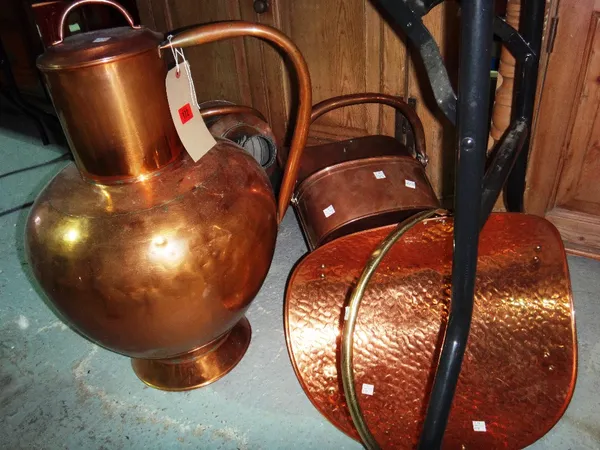 A group of 20th century copper wares, including a lidded baluster shaped vessel, another smaller, a coal basket and a log basket.