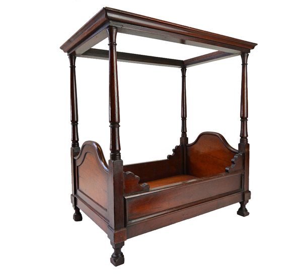 A mahogany framed cat bed in the form of a four poster bed, on turned supports, 43cm wide x 48cm high.  Illustrated