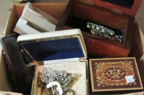 A Victorian figured walnut slope front stationery box with fitted interior and calendar aperture.