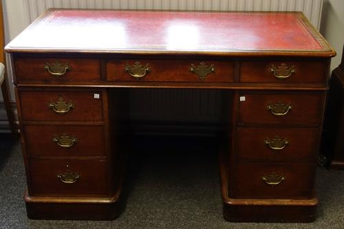A Victorian mahogany pedestal desk with nine drawers about the knee, on plinth base, 122cm wide.