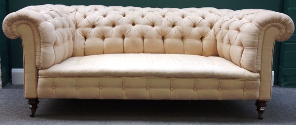 A Victorian button back Chesterfield sofa on turned mahogany supports, 186cm wide.