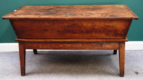 A large 18th century oak and elm dough bin on tapering square supports, 148cm wide.
