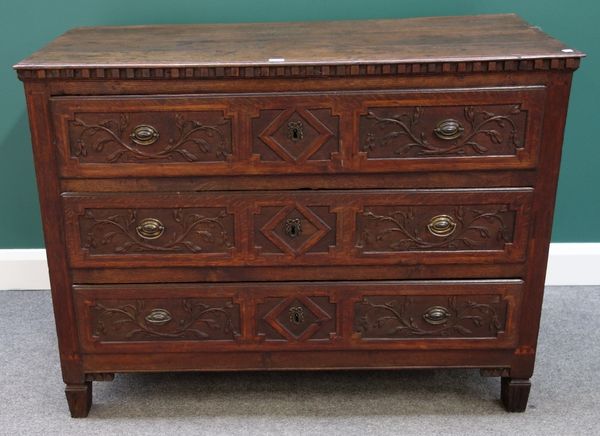 A 19th century French oak commode, with three floral carved long drawers, on tapering square supports, 122cm wide.