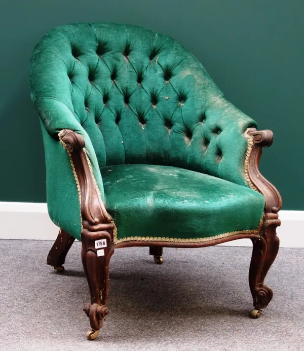 A Victorian rosewood tub back easy armchair with serpentine seat on scroll supports.