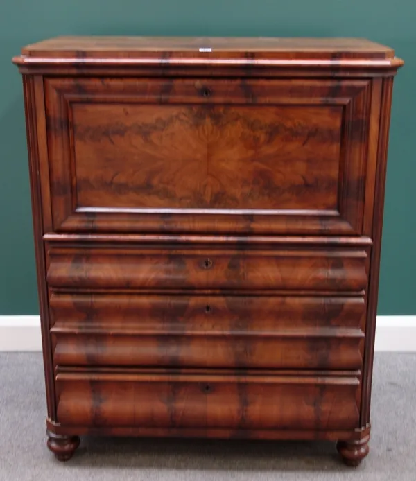 A 19th century mahogany Biedermeier secretaire a abattant, the fall revealing a fitted interior over three shaped drawers, on bun feet, 103cm wide.