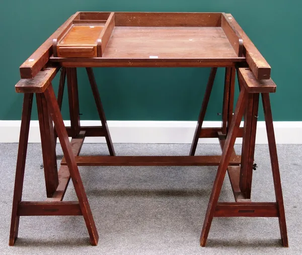 A 20th century hardwood architect's table, with height and angle adjustment top on a pair of 'A' frame trestle supports, 77cm wide.