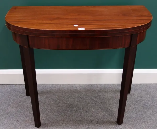 A George III inlaid mahogany bowfront card table on tapering square supports, 89cm wide.