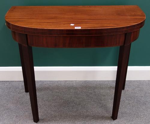 A George III inlaid mahogany bowfront card table on tapering square supports, 89cm wide.